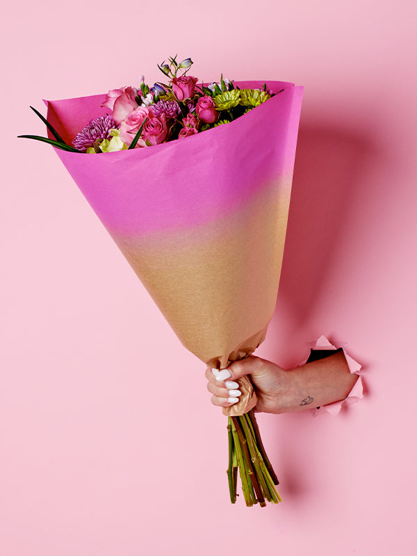 Elm Sleeve in Hot Pink, lifestyle image with flowers