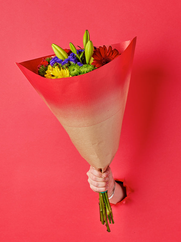 Elm Sleeve in Red, lifestyle image with flowers