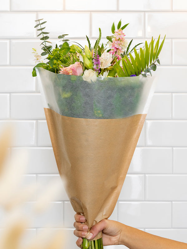 Glassine Floral Sleeve lifestyle image with flowers