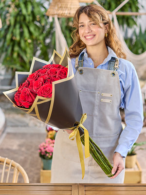 Florist holding madonna wrap in black