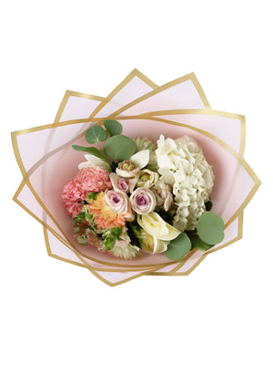 Aerial view of the Madonna Wrap in pink, with flowers