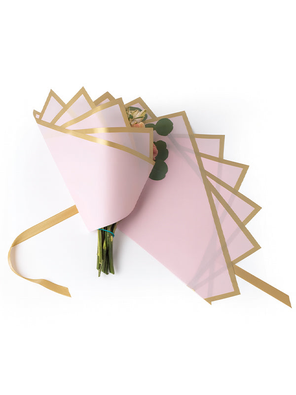 Madonna Wrap in pink, with only half of the wrap, wrapped around a bouquet