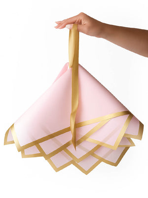 Madonna Wrap in pink, being held upside down