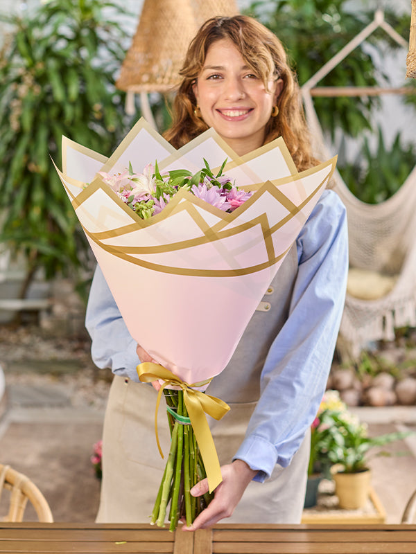Madonna Wrap in pink, lifestyle photo with florist holding flowers wrapped in the Madonna