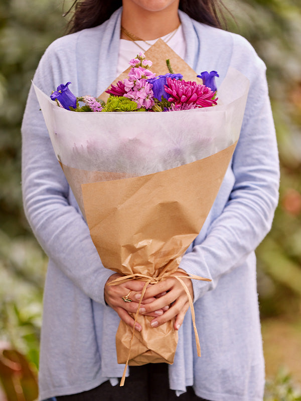 Woman Holding Floral Paper Wrap