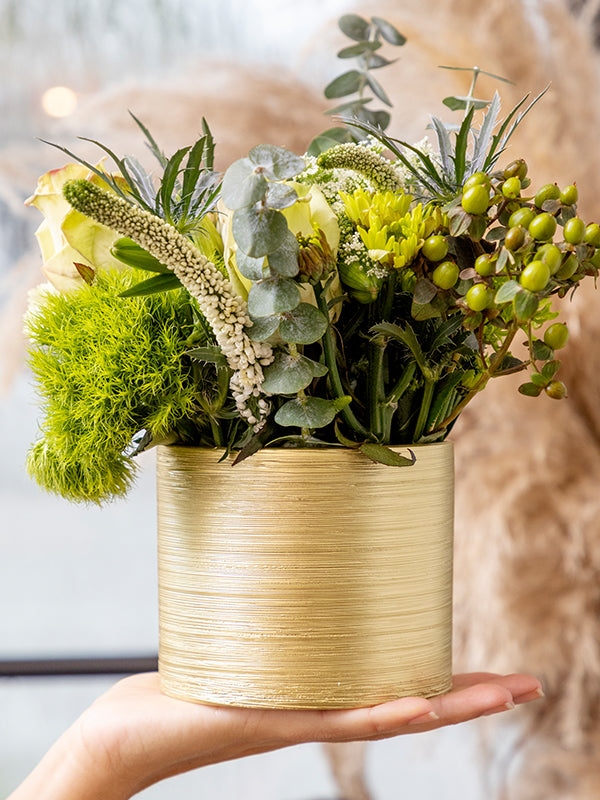 Gold vase with flowers